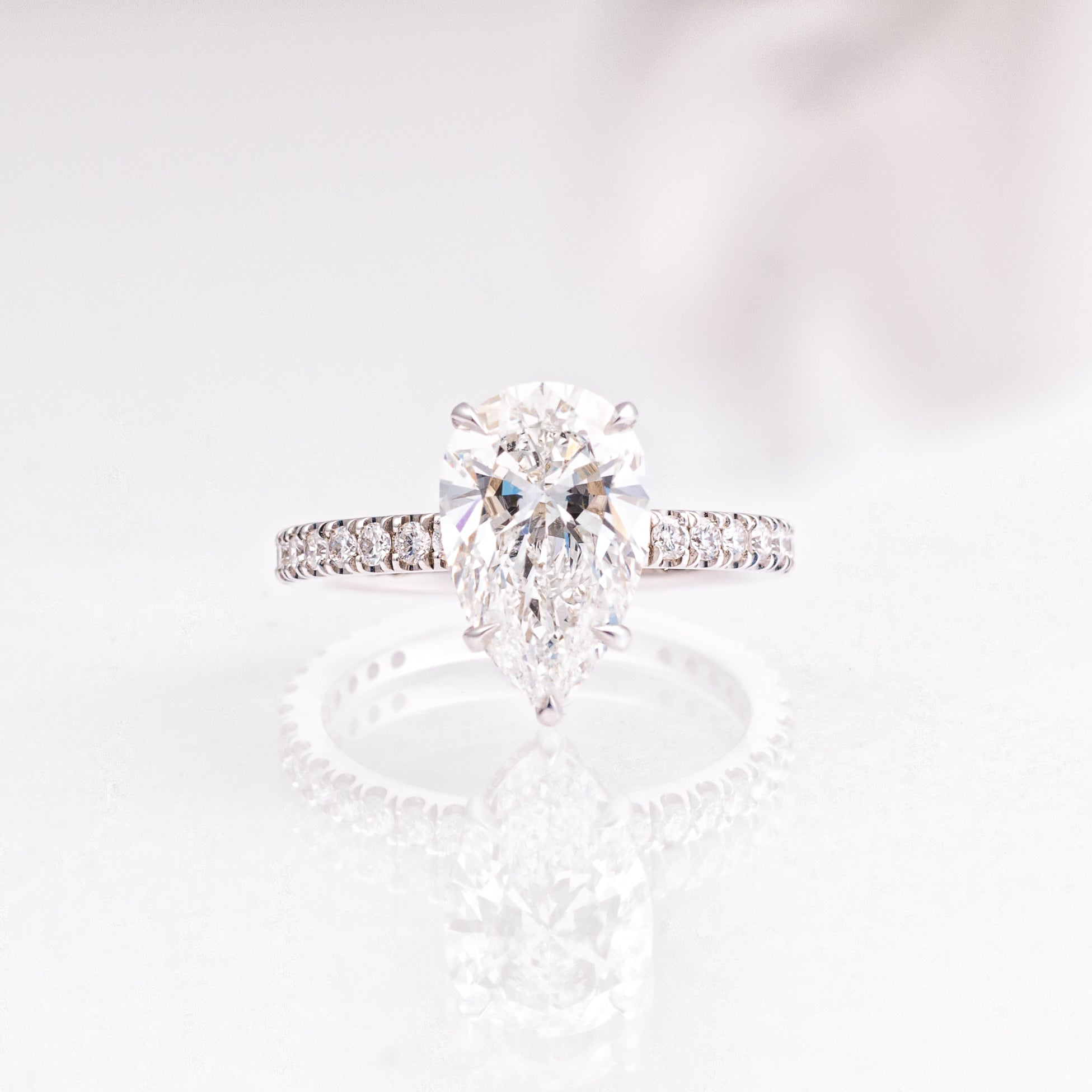 3.03 Carat Pear Diamond Engagement Ring with Hidden Halo and Pavé Band in 14K White Gold